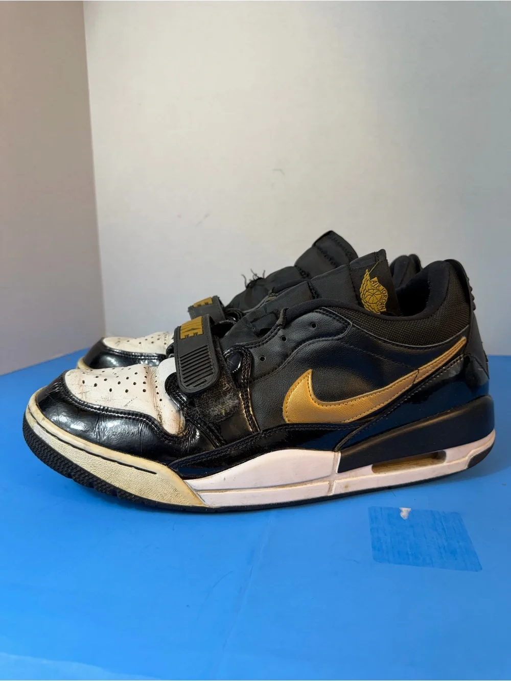 Jordan Black, White & Gold Strap Sneakers